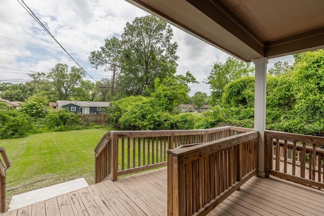 9205 Shepherd Dr, Beaumont, TX 77707 - wooden deck featuring a yard and view of wooded area