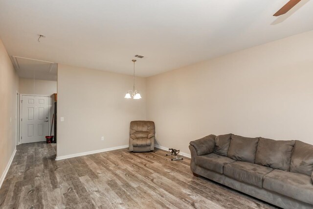 9205 Shepherd Dr, Beaumont, TX 77707 - living room with attic access, wood finished floors, baseboards, and a ceiling fan