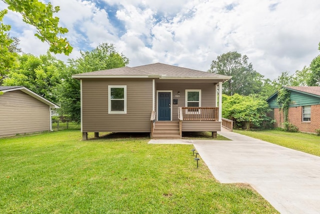 9205 Shepherd Dr, Beaumont, TX 77707 - bungalow-style home with covered porch, a front lawn, driveway, and roof with shingles