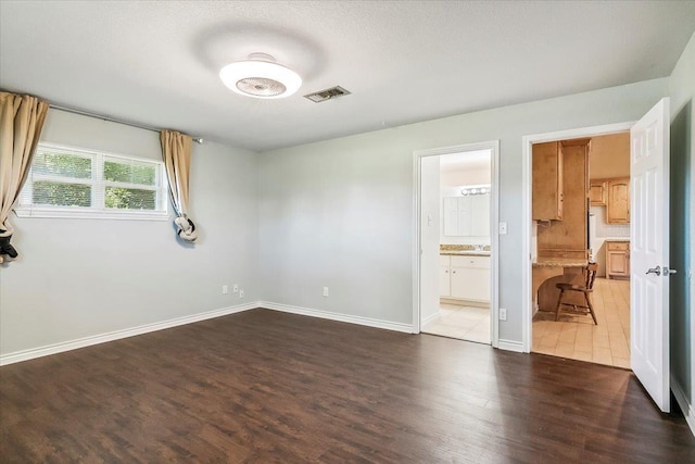 empty room with dark hardwood / wood-style floors