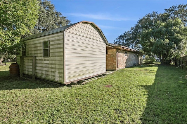 view of outbuilding featuring a lawn