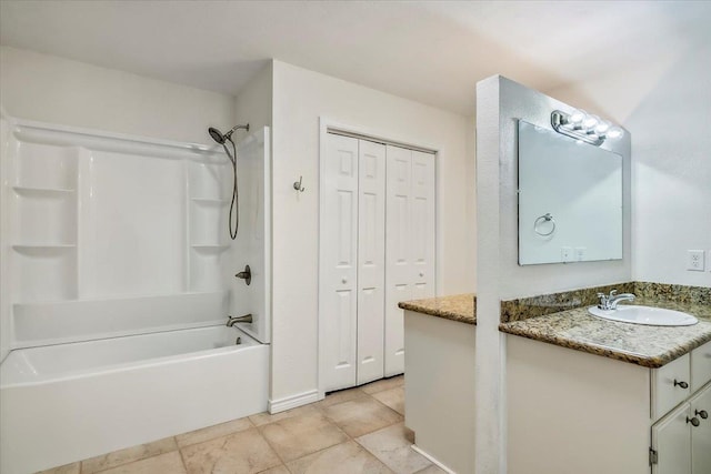 bathroom with washtub / shower combination and vanity