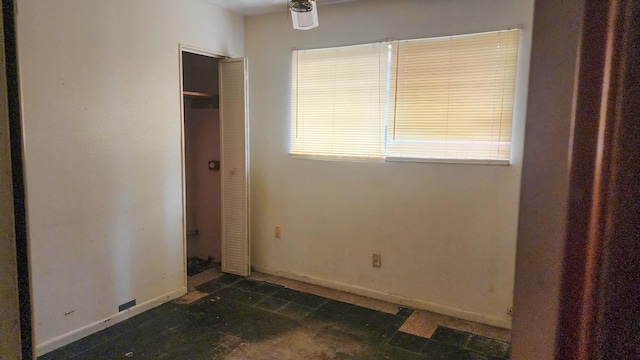 unfurnished bedroom featuring baseboards