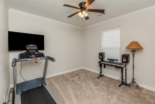 exercise area with light carpet, a textured ceiling, ceiling fan, and ornamental molding