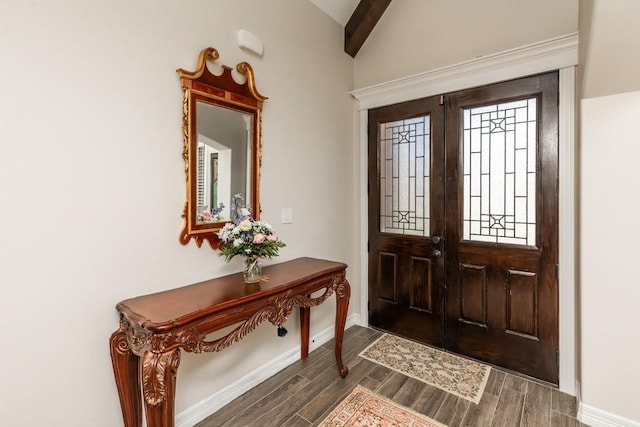 foyer featuring french doors and lofted ceiling with beams