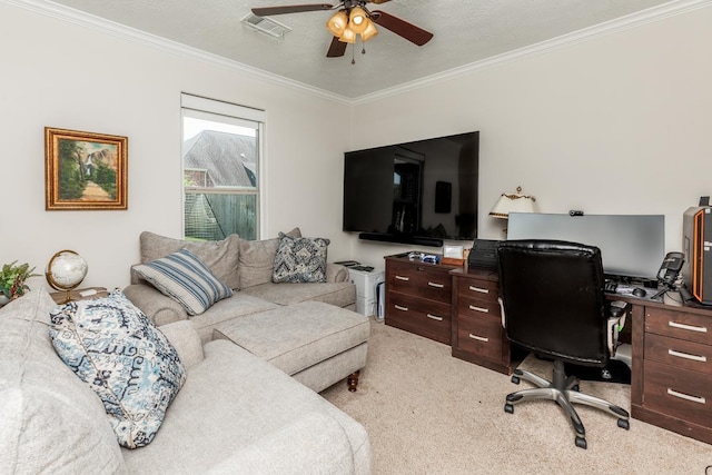 home office with crown molding, ceiling fan, light colored carpet, and a textured ceiling