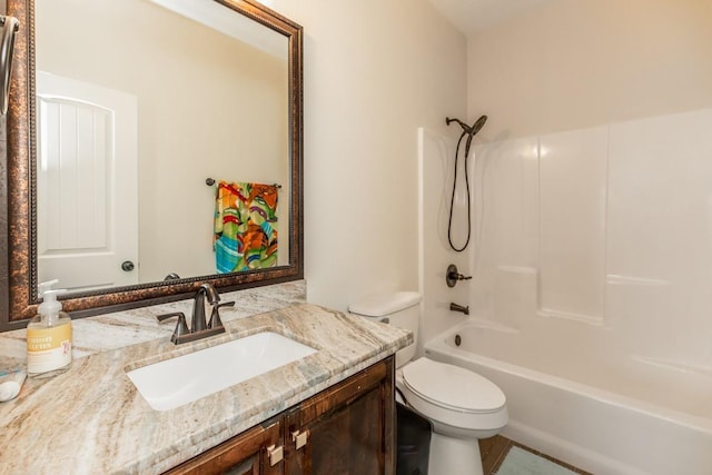 full bathroom with vanity,  shower combination, and toilet