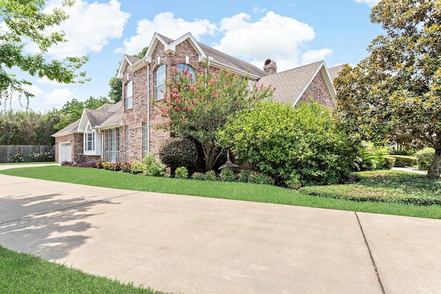 view of side of property featuring a garage