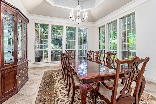 dining space featuring ornamental molding, a raised ceiling, light tile patterned floors, a chandelier, and lofted ceiling