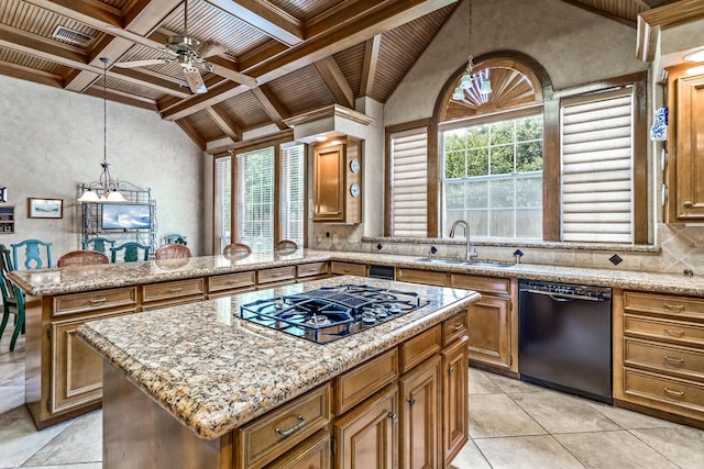 kitchen featuring black dishwasher, a kitchen island, hanging light fixtures, and sink