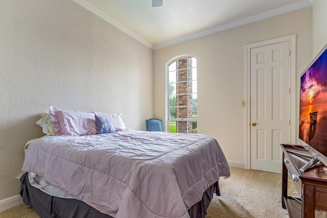 bedroom featuring ceiling fan, light carpet, and ornamental molding