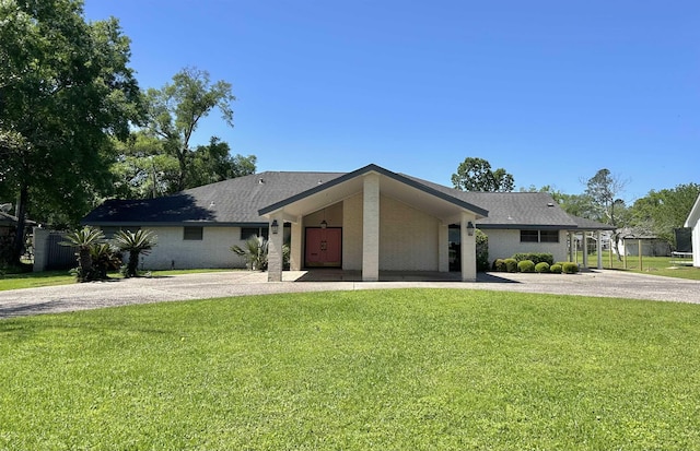 ranch-style home with a front yard