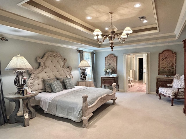 carpeted bedroom with a notable chandelier, a raised ceiling, and ornamental molding