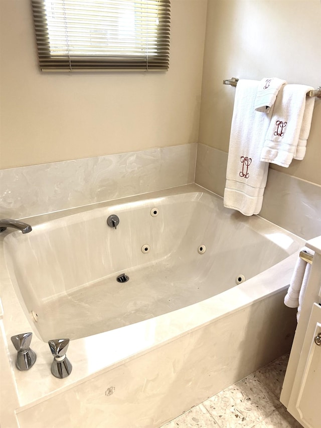 bathroom featuring a washtub