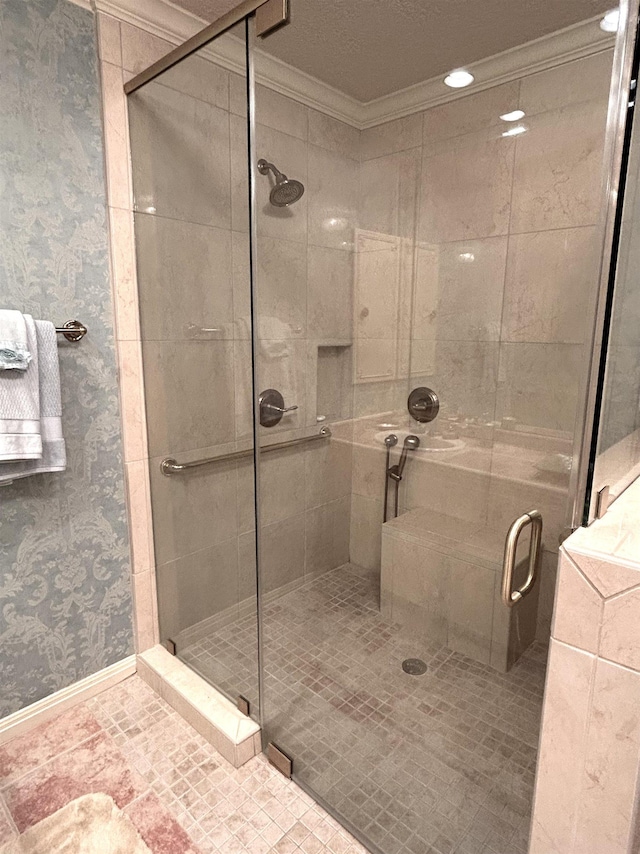 bathroom featuring ornamental molding and walk in shower