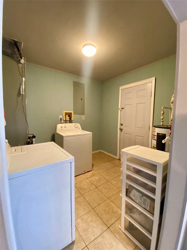1228 Bahama Ln, Port Bolivar, TX 77650 - laundry area with washer and clothes dryer, electric water heater, light tile patterned floors, and electric panel