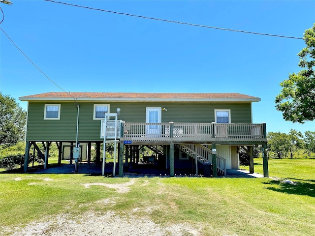 1228 Bahama Ln, Port Bolivar, TX 77650 - back of house with a carport, stairway, driveway, a deck, and a yard
