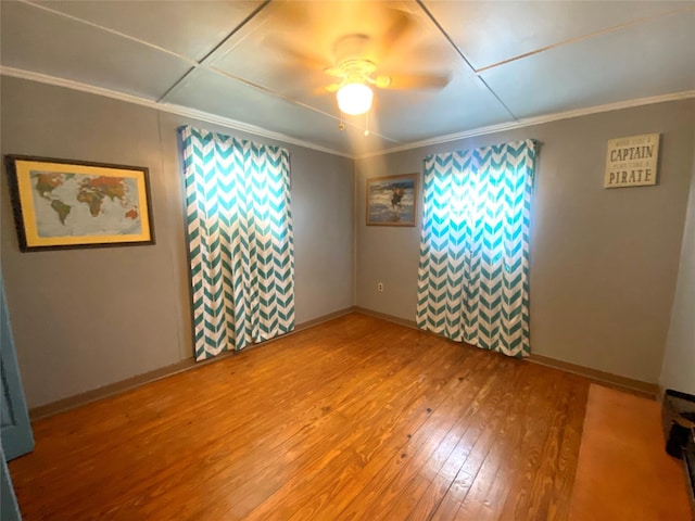 1228 Bahama Ln, Port Bolivar, TX 77650 - spare room featuring ornamental molding, hardwood / wood-style flooring, ceiling fan, and baseboards