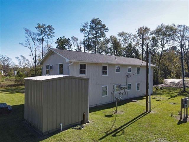 434 US Highway 96, Buna, TX 77612 - rear view of property featuring a yard