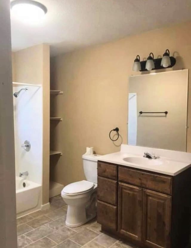 434 US Highway 96, Buna, TX 77612 - full bathroom with tub / shower combination, toilet, and vanity