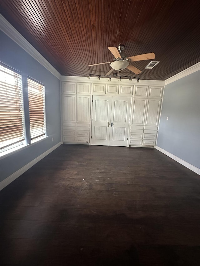 unfurnished bedroom featuring crown molding, ceiling fan, and dark hardwood / wood-style floors