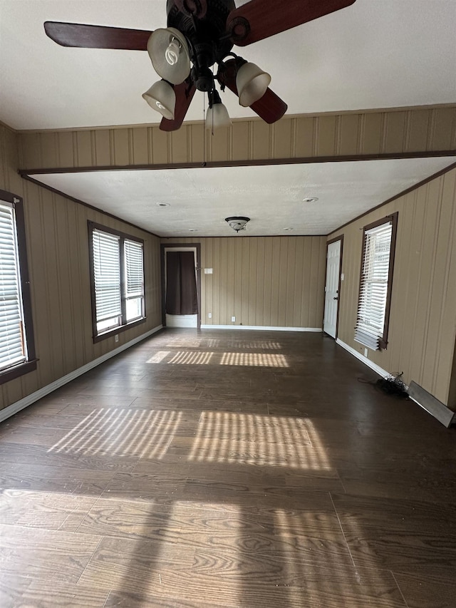 empty room featuring wood-type flooring and ceiling fan