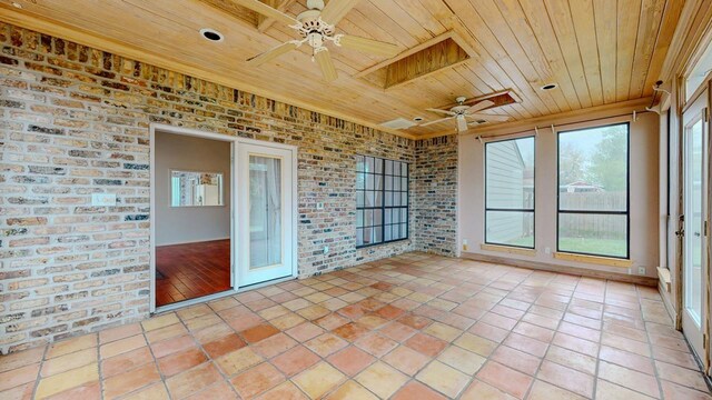 1995 Sams Way, Beaumont, TX 77706 - unfurnished sunroom with wooden ceiling, brick wall, and tile patterned flooring