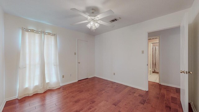 1995 Sams Way, Beaumont, TX 77706 - spare room featuring wood finished floors, ceiling fan, and baseboards
