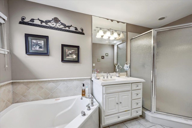 full bath with vanity, a bath, and a shower stall