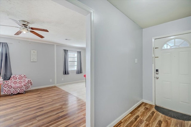 entrance foyer featuring hardwood / wood-style flooring and ceiling fan