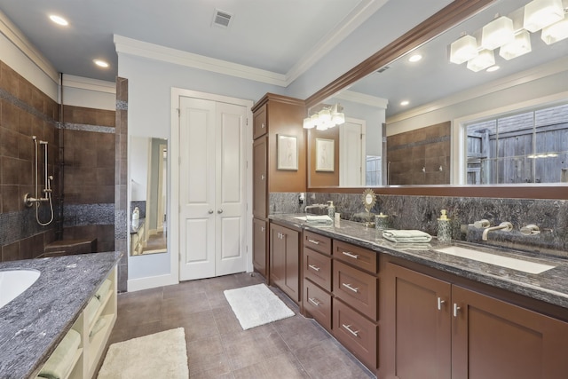 bathroom with a sink, double vanity, walk in shower, ornamental molding, and backsplash