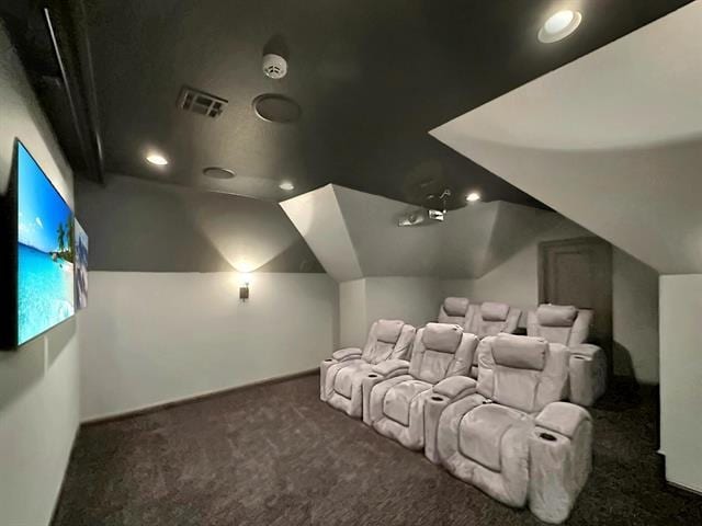 cinema featuring carpet, visible vents, recessed lighting, and vaulted ceiling