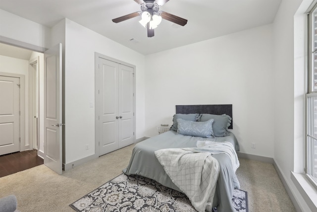 bedroom with visible vents, ceiling fan, baseboards, and carpet floors