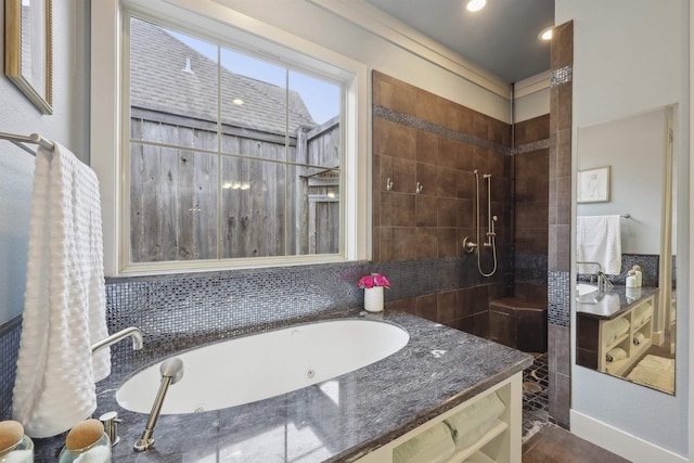 full bath featuring a tub with jets and tiled shower