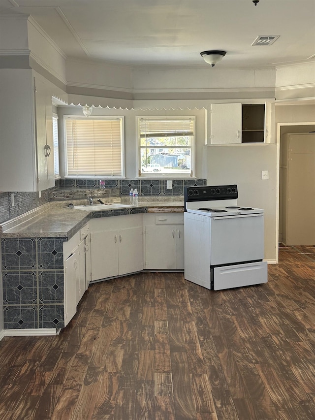 kitchen featuring backsplash, white range with electric cooktop, crown molding, and white cabinets