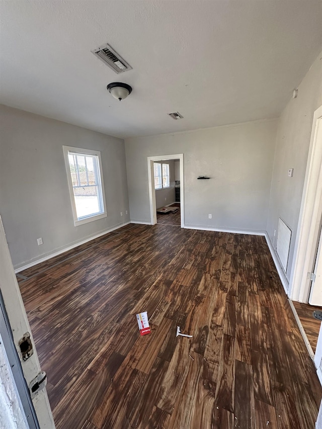 unfurnished room featuring dark hardwood / wood-style floors