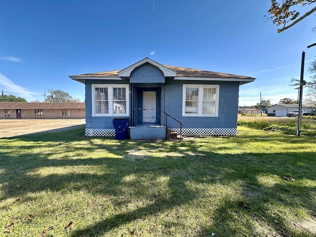 bungalow with a front yard