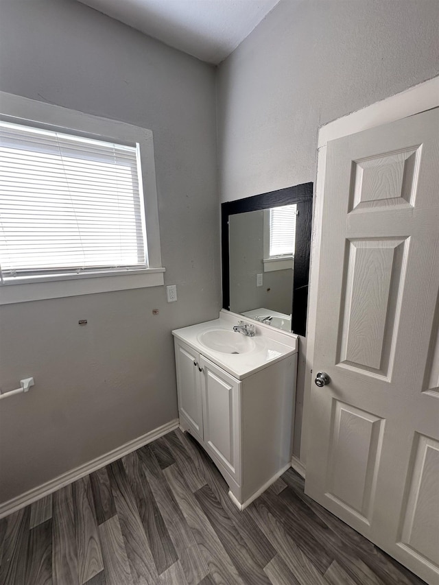 bathroom featuring vanity and hardwood / wood-style flooring