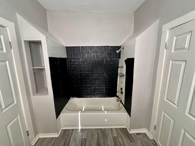 bathroom featuring shower / bathtub combination and wood-type flooring