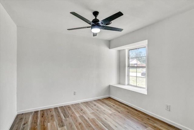 empty room with ceiling fan and light wood-type flooring