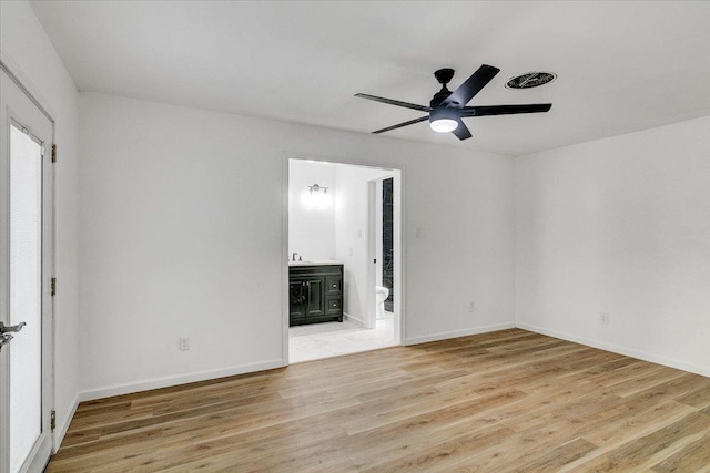 unfurnished room with ceiling fan and light hardwood / wood-style flooring