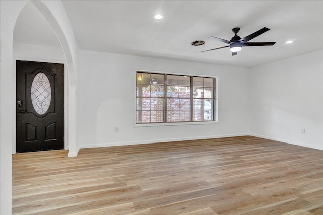 entrance foyer with ceiling fan and light hardwood / wood-style floors