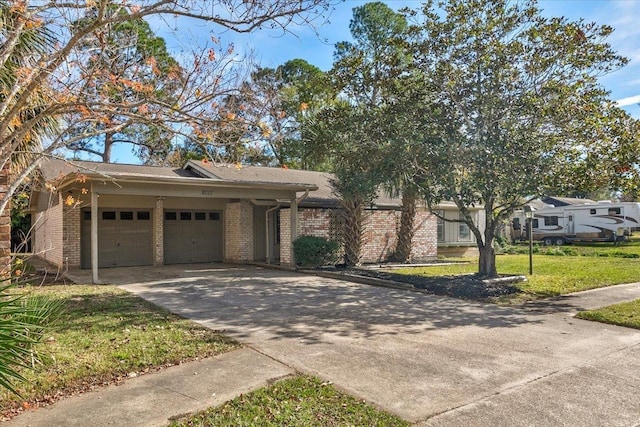 view of front of house featuring a garage and a front yard