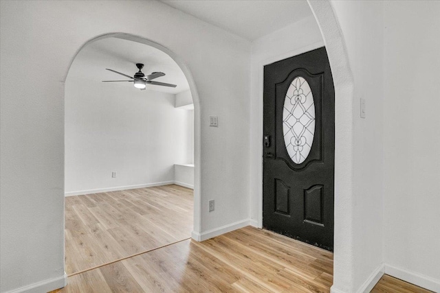 entryway with ceiling fan and light hardwood / wood-style flooring