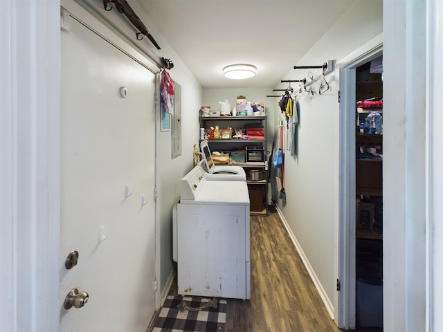 washroom with dark hardwood / wood-style flooring and washer and clothes dryer