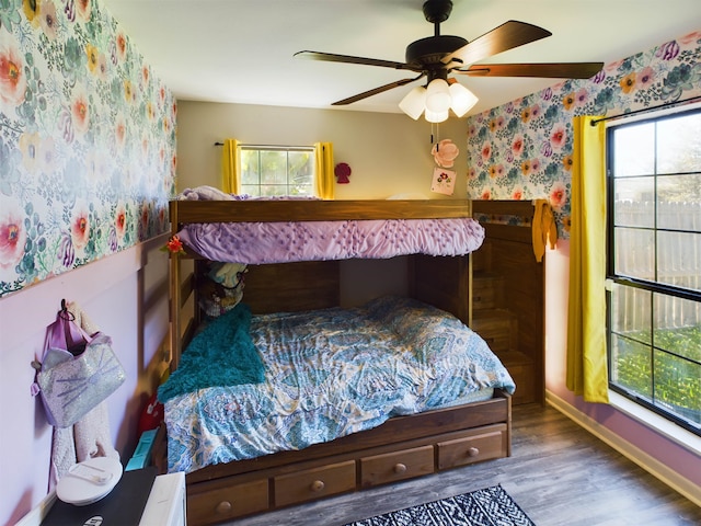 bedroom featuring hardwood / wood-style flooring and ceiling fan