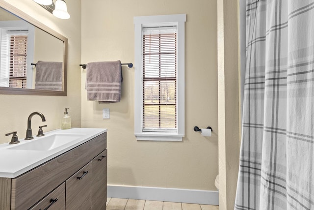 165 Trahan Rd, Lumberton, TX 77657 - bathroom with baseboards, vanity, tile patterned floors, and a shower with shower curtain