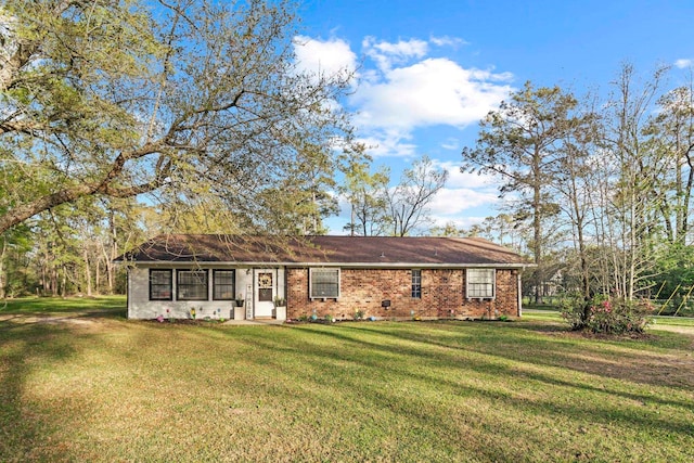 165 Trahan Rd, Lumberton, TX 77657 - ranch-style house with a front yard and brick siding