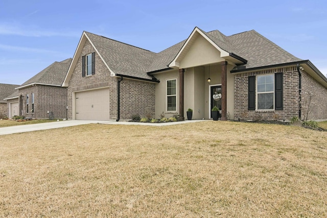 view of front facade with a garage and a front lawn