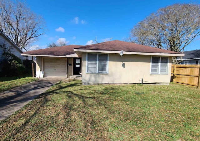 view of front of property featuring a garage and a front lawn